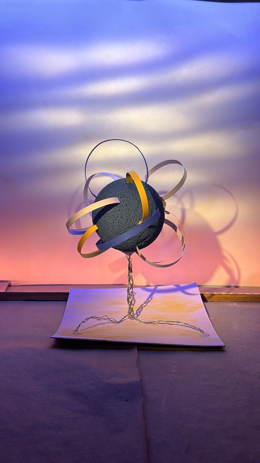 Sydney Jasper · Painting with Light: the Form & Texture sphere lit with warm peach light from below and cool blue from behind and above, the colors blending into a soft gradient on the rear cyc